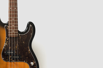 Old bass guitar on white background. Vintgae music wallpaper