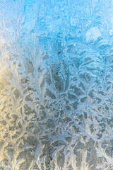 Frozen winter window with shiny ice frost pattern texture. Christmas wonder symbol, abstract background. Extreme north low temperature, natural Ice snow on frosty glass, cool winter weather outdoor