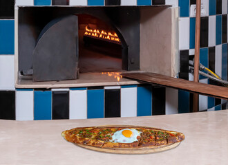 Turkish food pita in front Burning stone oven. Close up