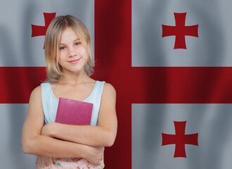 Young cute student girl smiling on flag of Georgia background