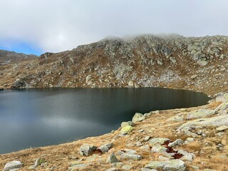 A crystal clear alpine lakes Laghi d'Orsirora during a beautiful autumn day in the mountainous area...