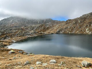A crystal clear alpine lakes Laghi d'Orsirora during a beautiful autumn day in the mountainous area...