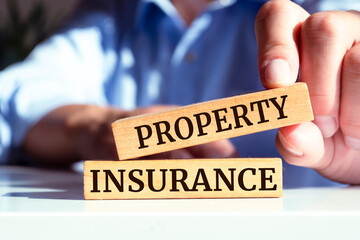 Wooden blocks with words 'Property Insurance'.