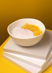 porridge with pineapple on a yellow background