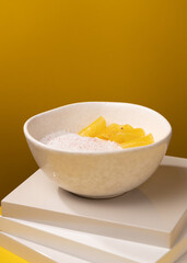 porridge with pineapple on a yellow background