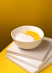 porridge with pineapple on a yellow background