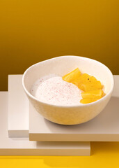 porridge with pineapple on a yellow background