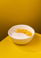 porridge with pineapple on a yellow background
