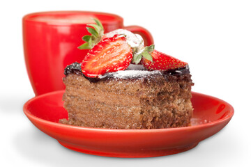 Delicious chocolate cake with cream and berries and cup of coffee
