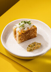 casserole with vegetables on a yellow background