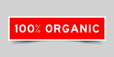 Sticker label with word 100 percent organic in red color on gray background