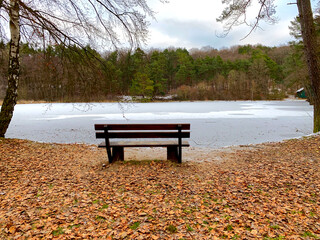 Bench on the edge of a frozen lake