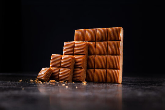 Sweet Chocolate Toffee Dessert Bar On A Dark Background.