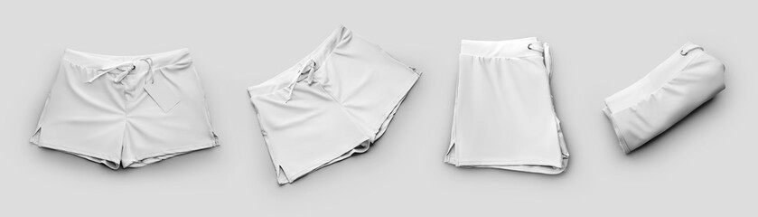 Set of white mockup male swimming trunks, subject close-up with ties, isolated on background.