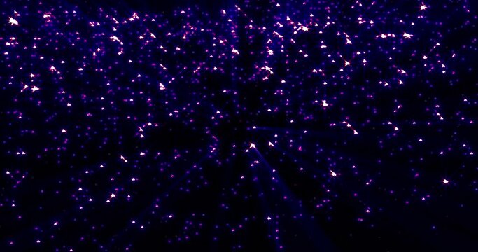 Bright luminous shiny purple beautiful mysterious rhinestone star particles on a black background. Abstract background, intro, video in high quality 4k