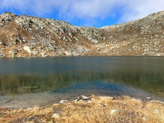 A crystal clear alpine lakes Laghi d'Orsirora during a beautiful autumn day in the mountainous area...