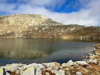 A crystal clear alpine lakes Laghi d'Orsirora during a beautiful autumn day in the mountainous area of the St. Gotthard Pass (Gotthardpass), Airolo - Canton of Ticino (Tessin), Switzerland (Schweiz)