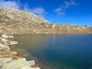 A crystal clear alpine lakes Laghi d'Orsirora during a beautiful autumn day in the mountainous area...