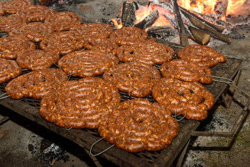 Barbecue, sausage and cow ribs, traditional argentine cuisine, Patagonia, Argentina.