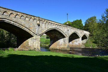 Beautiful Old Stone Archway Bridge Over a River