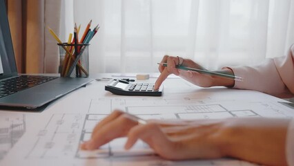 Female specialist develops interior design for new apartment