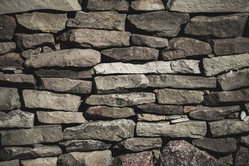 Stone wall fence made of natural stone, stone texture detailed, in the highlands of the Caucasus