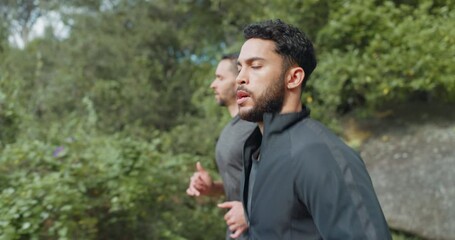Running, fitness and people in nature forest for training, outdoor wellness or challenge with focus, motivation and energy. Sports men friends, personal trainer athlete exercise together in mountain