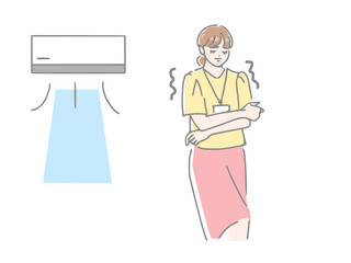エアコンの冷房が効きすぎて寒くて震える女性