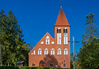 General view and architectural details of the Protestant temple, erected in 1905, now as the Catholic Church of Our Lady of Perpetual Help in the town of Spychowo in Masuria in Poland.