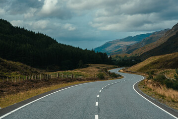 A waving road in the middle of mountais in the Highlands, Scotland