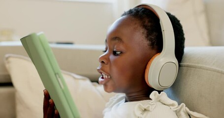 Language learning, headphones and black child with tablet for online education translation website or video call. Relax kid with digital technology listening and speaking for online learning games - Powered by Adobe
