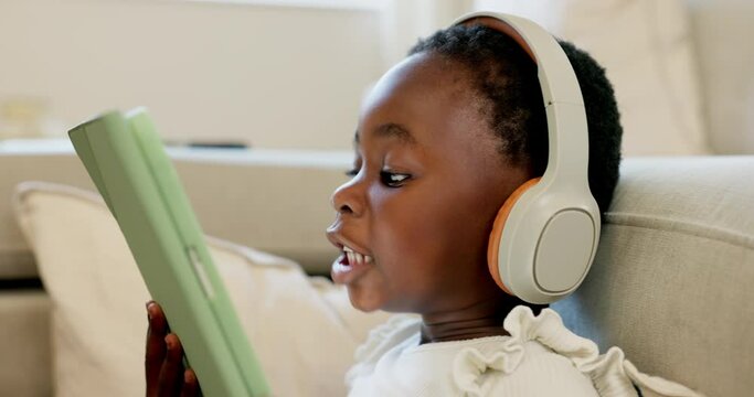 Language learning, headphones and black child with tablet for online education translation website or video call. Relax kid with digital technology listening and speaking for online learning games