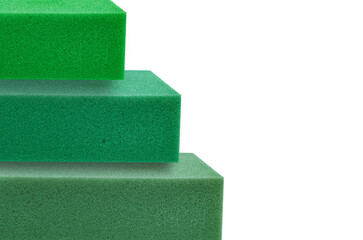 stack of green thick sponge foam square pieces with copy space