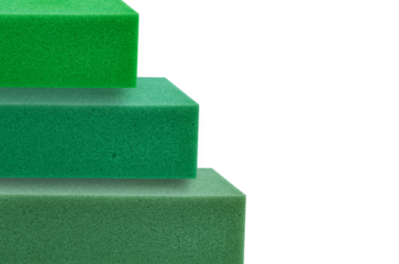 stack of green thick sponge foam square pieces with copy space