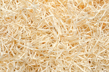 Wood wool background from above. Also known as excelsior, made of wood slivers cut from logs. Used...