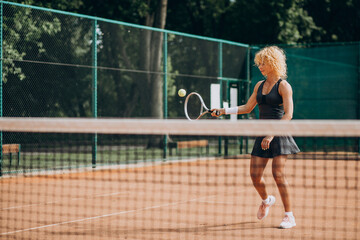 Fototapeta na wymiar Female tennis player at the tennis court