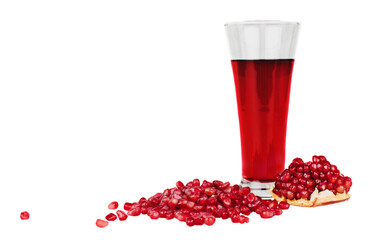 Glass of pomegranate juice with fruit isolated on white.