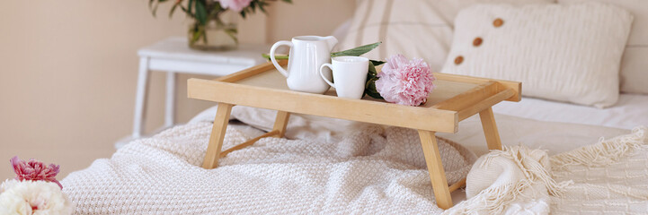 Banner bouquet of fresh flowers in a home light modern interior. Fresh flowers in the morning in the bedroom.