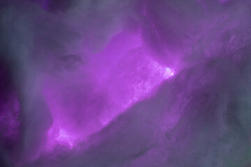 Abstract image made using colored light and cotton snow, artificial snow. Dramatic concept of clouds in the sky, storm at sea, light and dark, atmospheric states. Background or wallpaper.