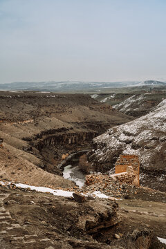 Picturesque landscape or narrow river between rocky hills in ancient abandoned town