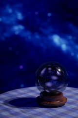 Crystal ball on a table with stars in background. 3D Illustration