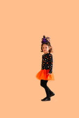 Happy girl dressed as a witch for Halloween	