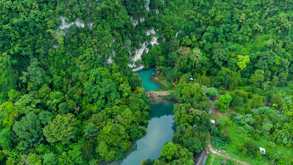Fototapeta na wymiar Aerial view of Pucok Krueng tourist attraction, the lake water is green tosca 