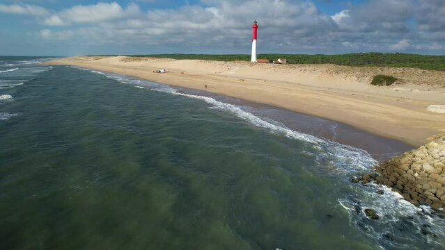 Aerial shot of the La Coubre wild beach and lighthouse in Charente Maritime, France