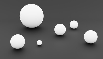 3d-rendering of some white balls with different sizes in front of a black background