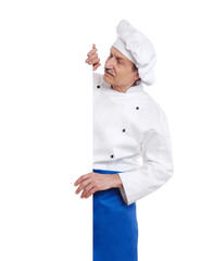 Chef cook looking to the blank board isolated on white