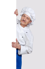 Chef holding blank board against grey background