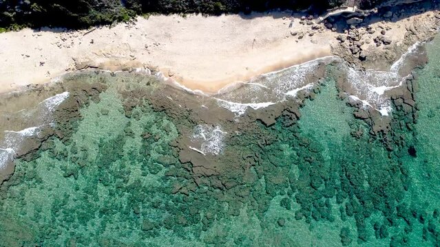 Aerial view of Lu Bagnu (Castelsardo) shore on a sunny day. Sardinia, Italy