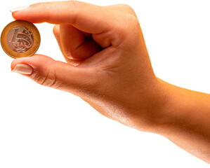 Hand holding one Real coin of Brazil on transparent background. Finance concept. PNG