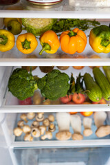 Fototapeta na wymiar Open fridge full of vegetables and fruits.